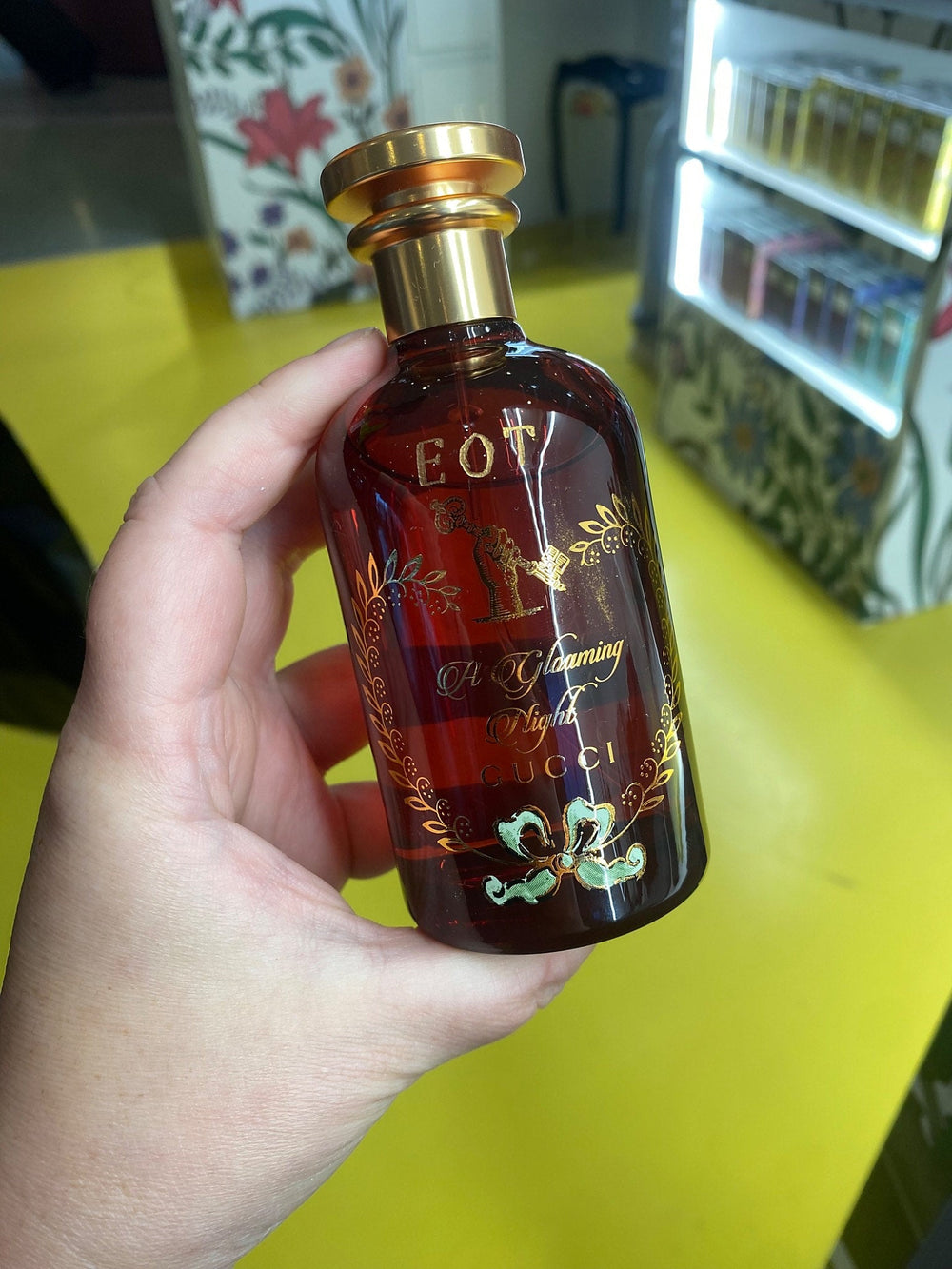 Gucci Flora Gorgeous Orchid fragrance bottles displayed at a JFK Airport brand activation in New York City.