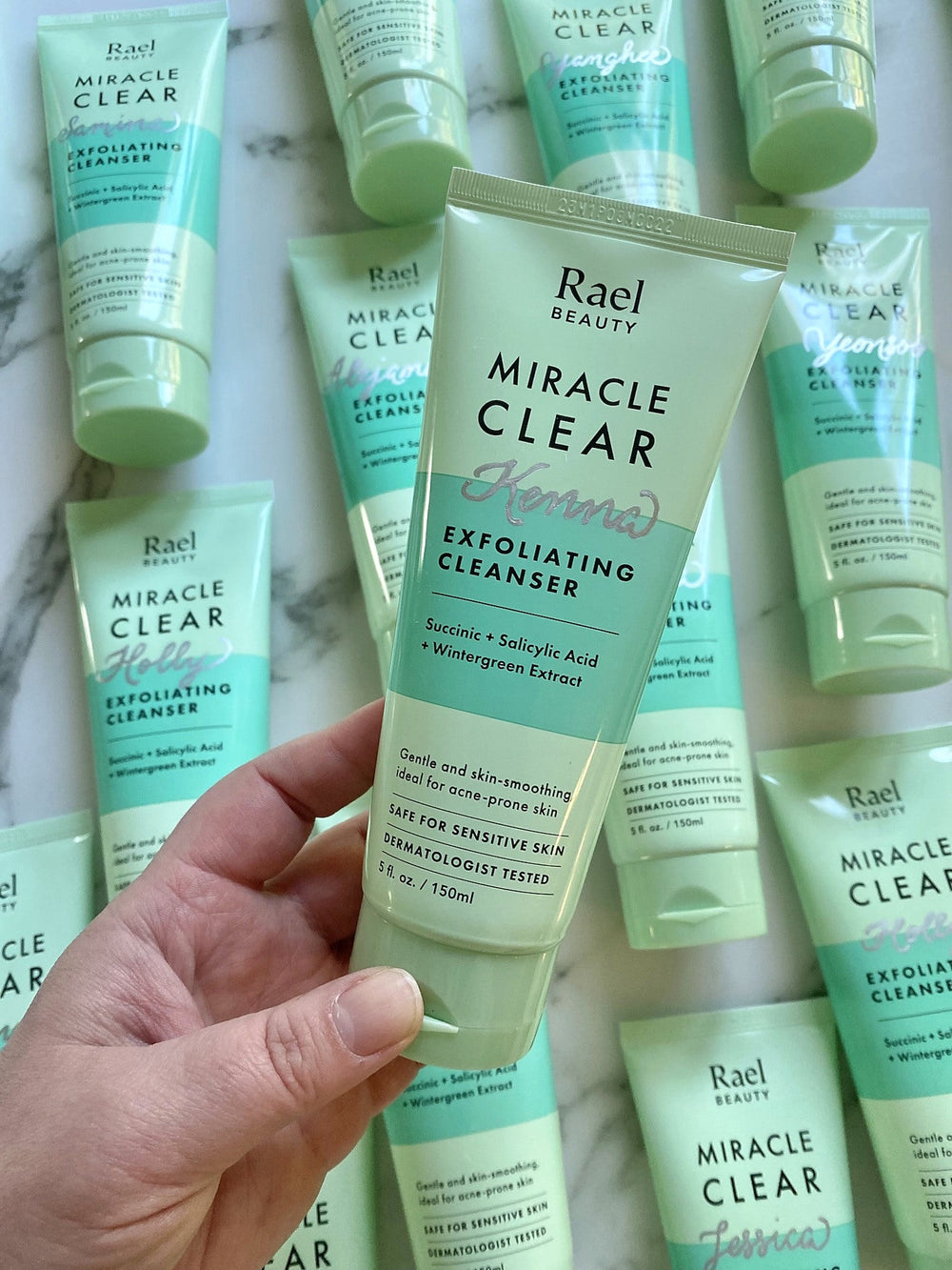 Rael Beauty Miracle Clear cleanser personalized with silver hand calligraphy for a luxury brand event.