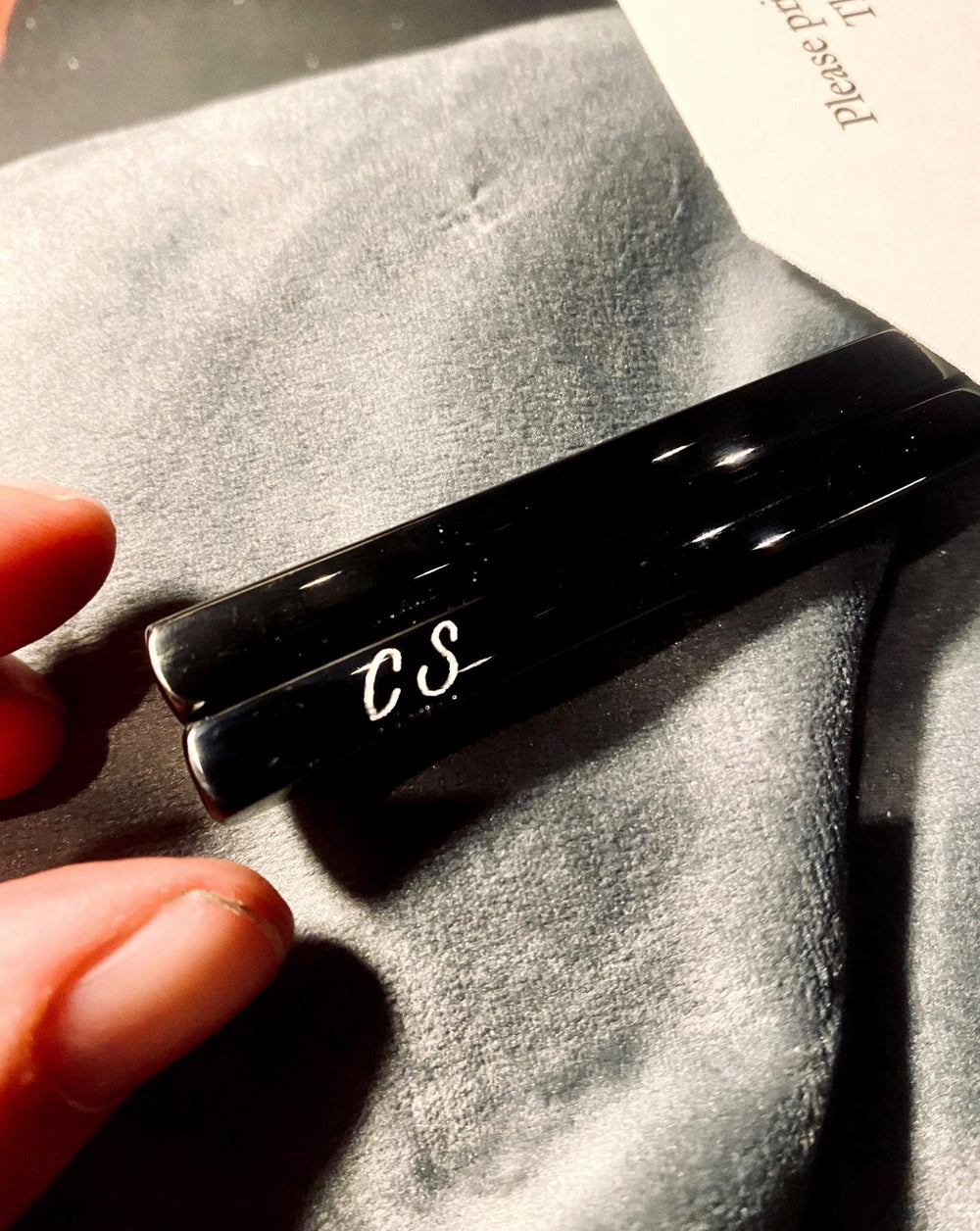 Custom hand-engraved initials on black chopsticks for View the Space's corporate event at Katsuya in New York City.
