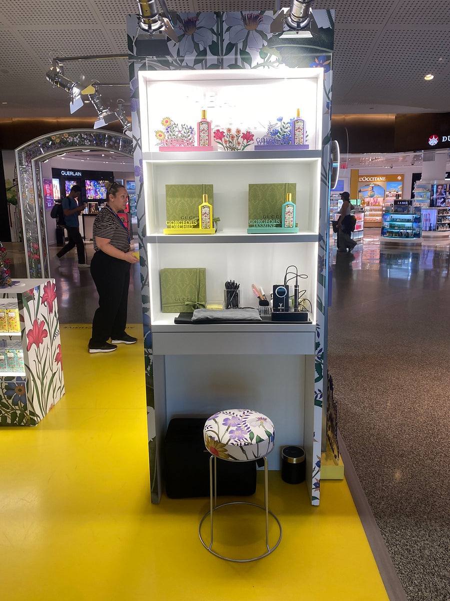 Gucci Flora floral pop-up installation at JFK Airport featuring a luxury fragrance retail activation.