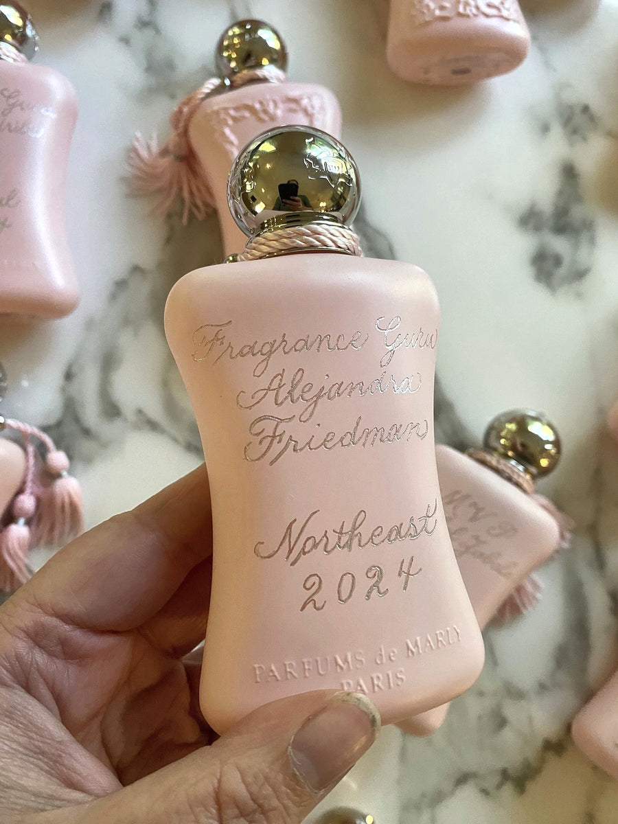 Hand engraved Parfums de Marly Delina fragrance bottle featuring a personalized Fragrance Guru award in elegant copperplate calligraphy.