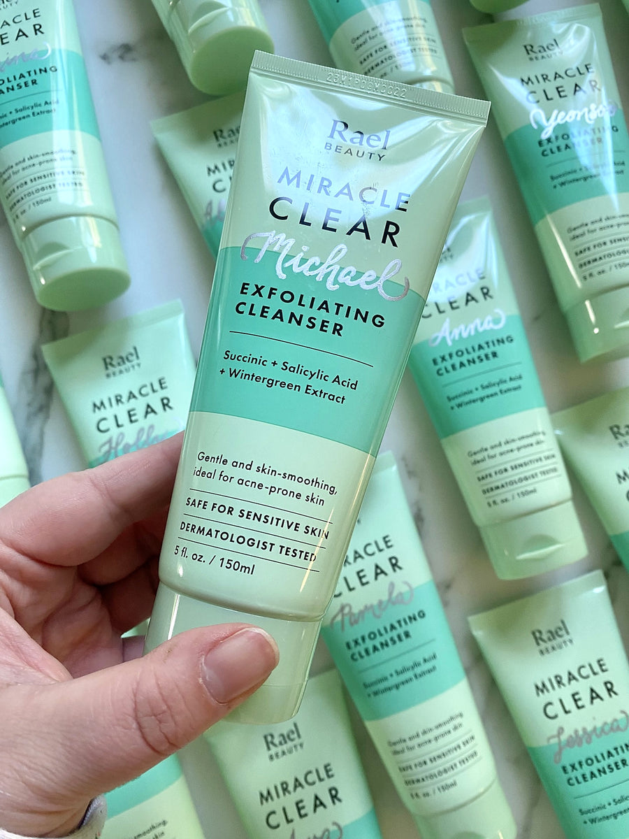 Close-up of silver hand-lettered personalization on a Rael Beauty Miracle Clear skincare cleanser.
