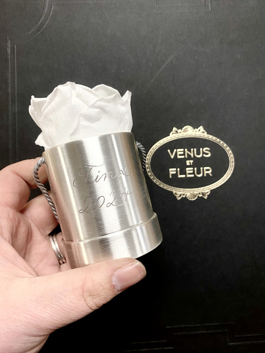 Close-up of delicate Copperplate calligraphy hand engraved on a Venus et Fleur silver rose holder
