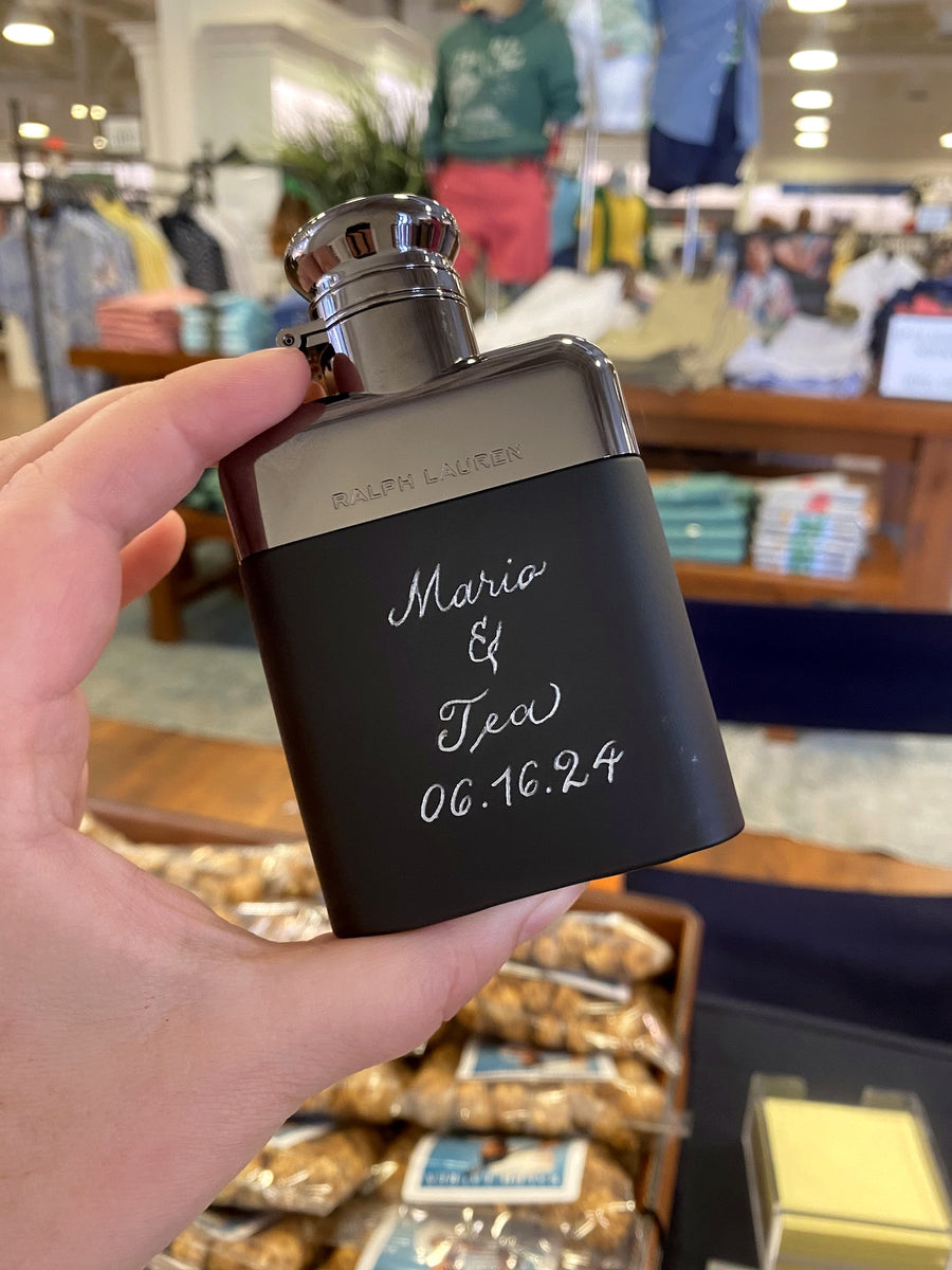 Personalized Ralph Lauren cologne bottle with custom hand-engraved message for a luxury retail gifting event in NYC.