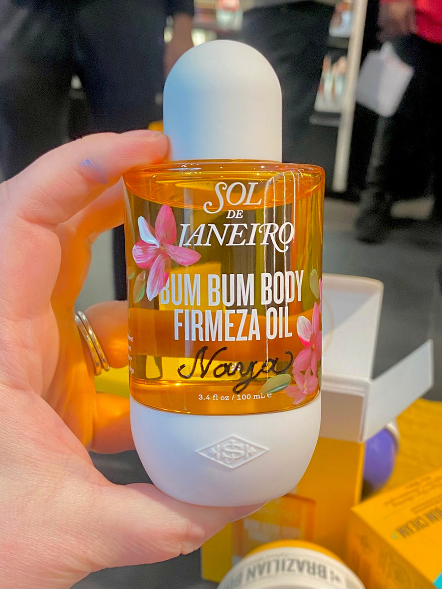 Sol de Janeiro Bum Bum Body Firmeza Oil with hand-painted pink flowers and personalized script lettering for a Sephora brand activation.