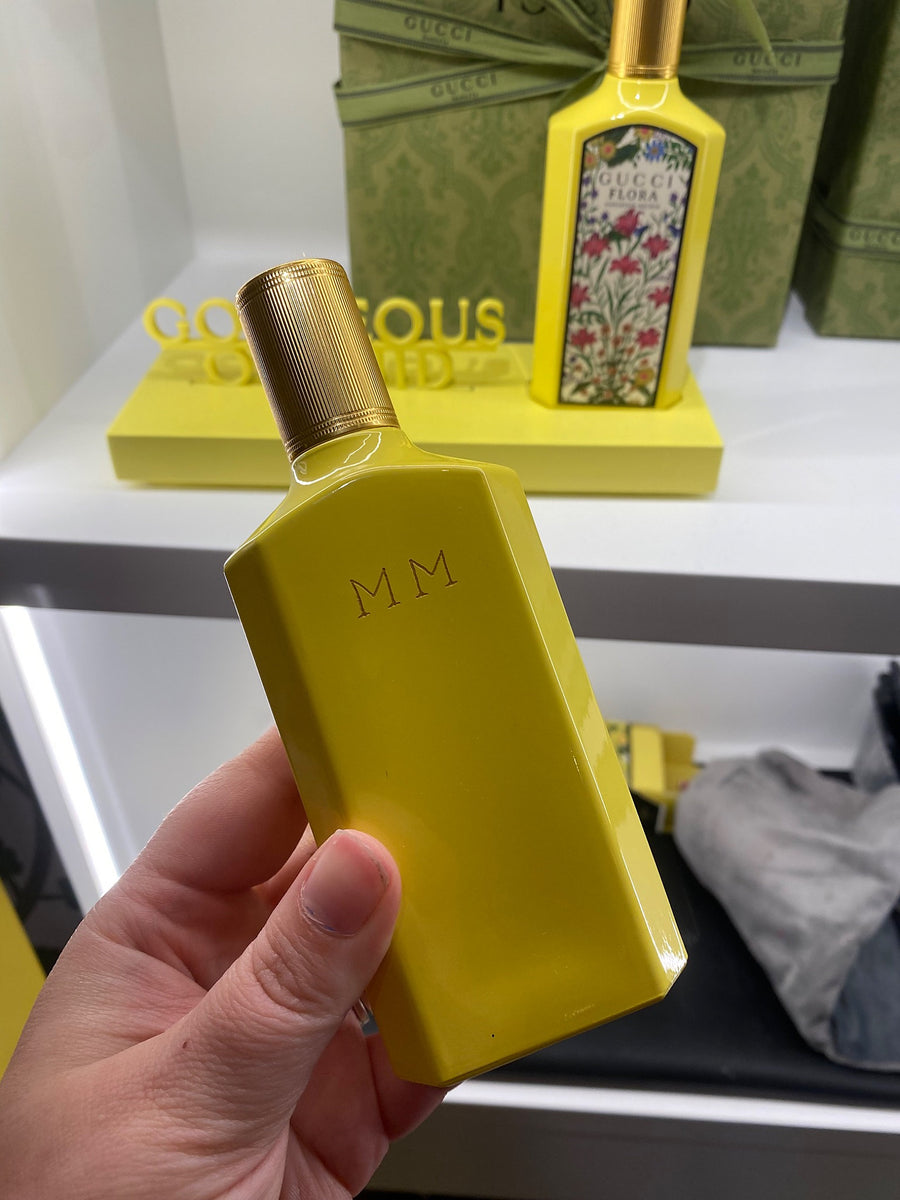 Gucci Flora fragrance bottle with custom MM monogram engraving for a luxury brand activation.