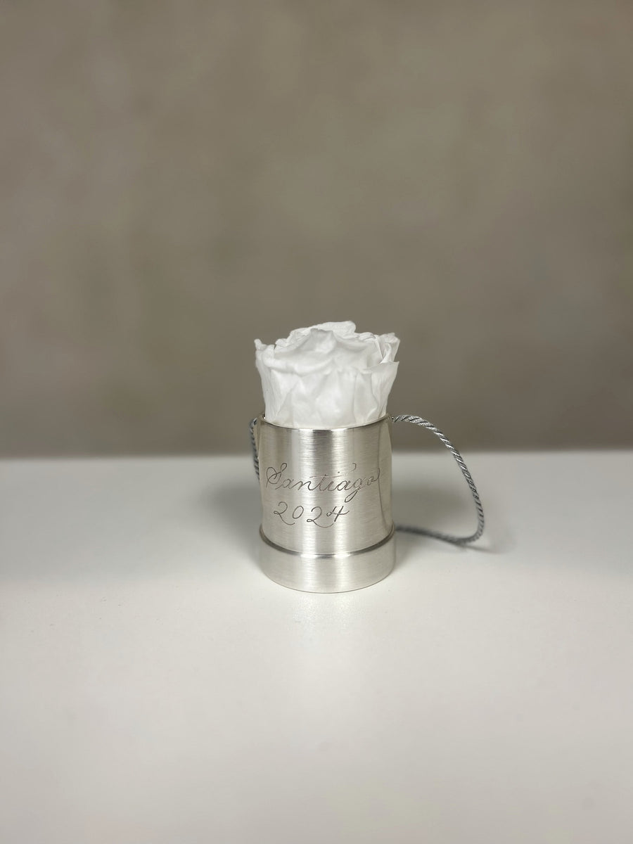 Collection of personalized Venus et Fleur silver rose holders with white preserved roses and custom engraving