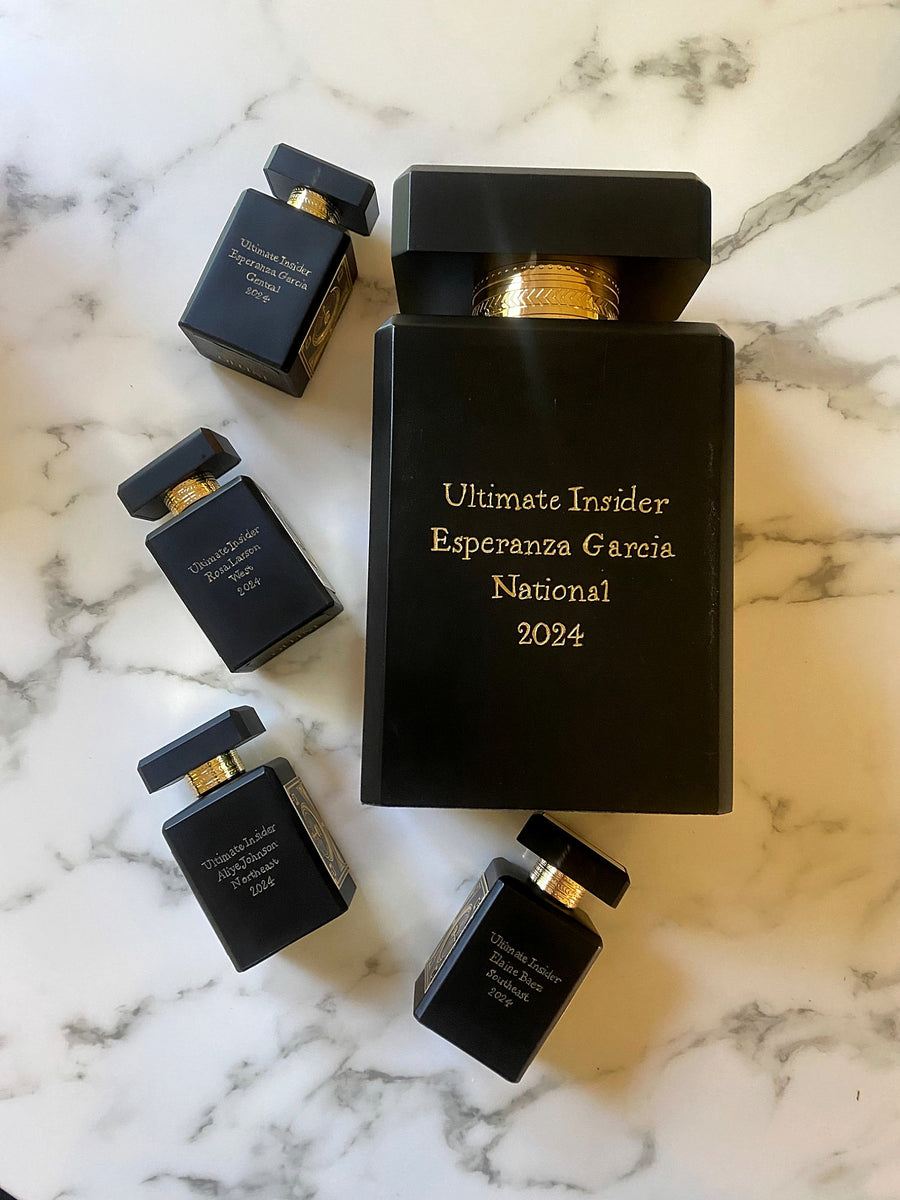 Large black Initio Parfums Privés fragrance bottle with personalized gold engraving for a national corporate award.